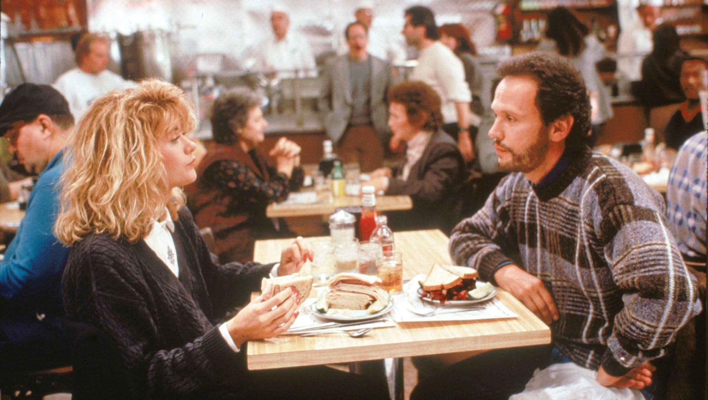 Man and women sitting in diner in the 90s
