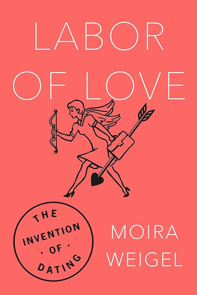 Dark pink book with cupid on cover.