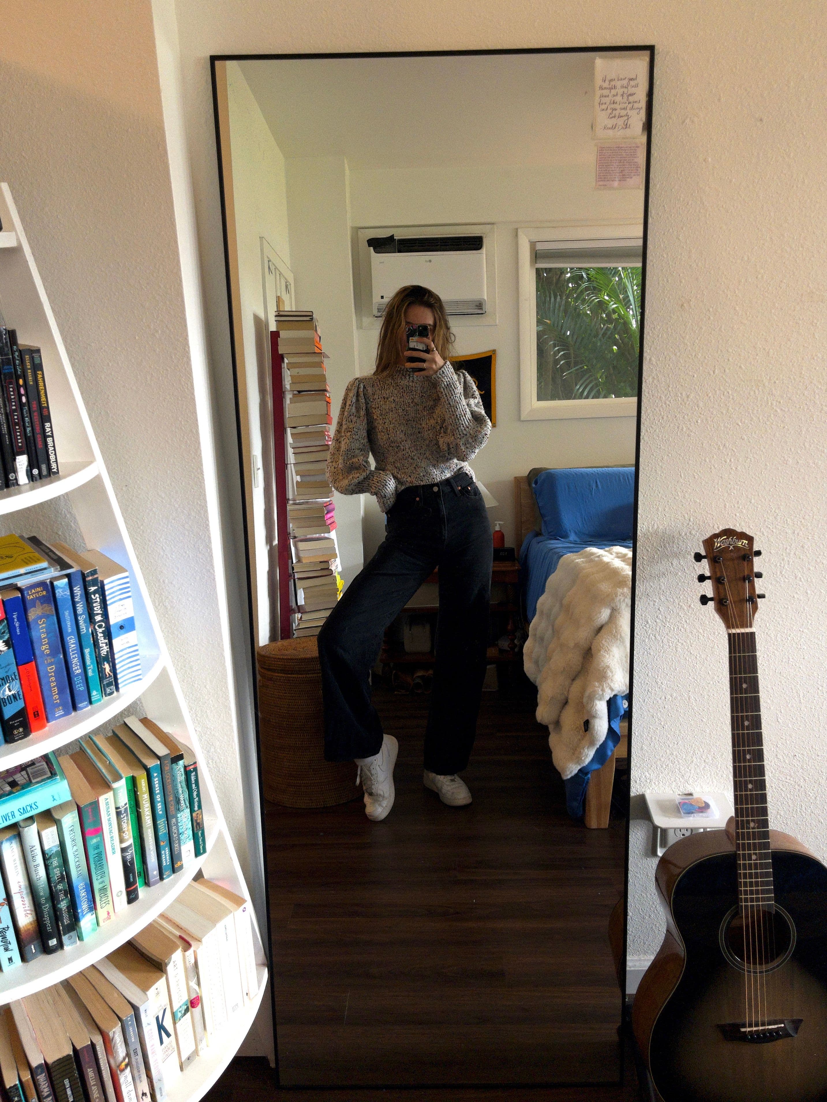 mirror selfie in white blouse, denim skirt, and cowboy boots