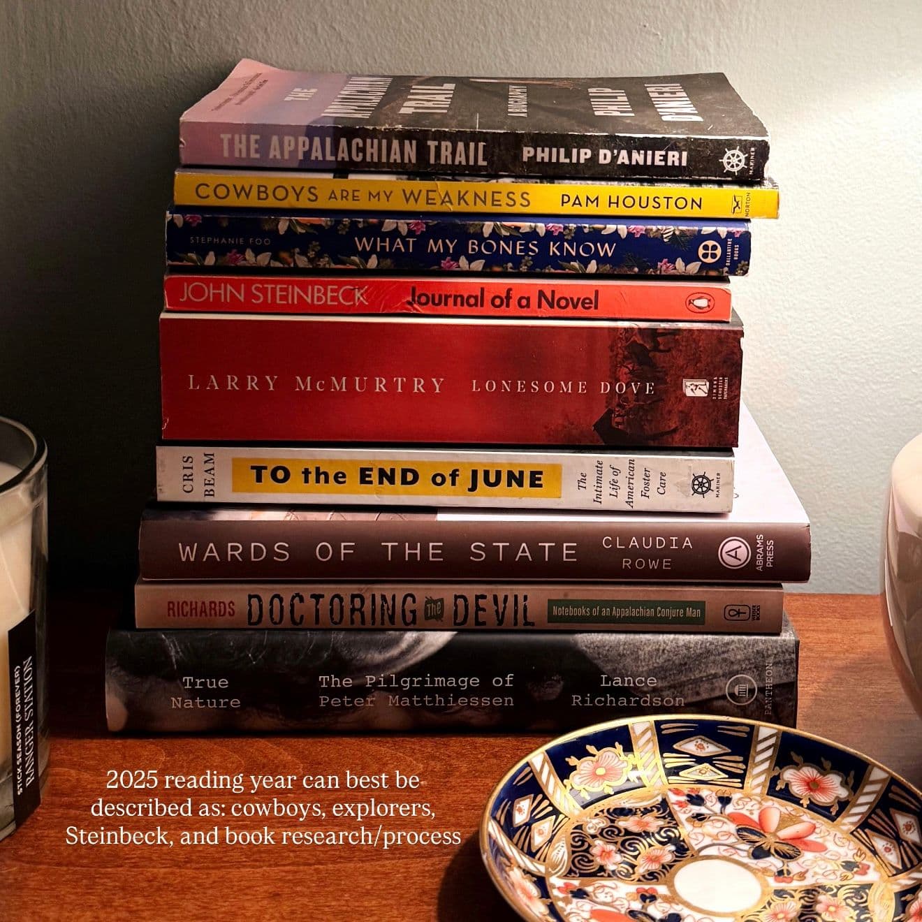 bedside stack of books