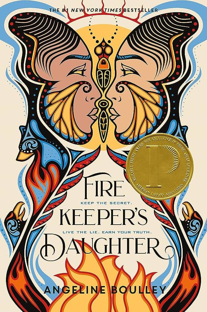A book cover with a Printz award sticker featuring two illustrated faces decorated with fire looking at each other symmetrically.